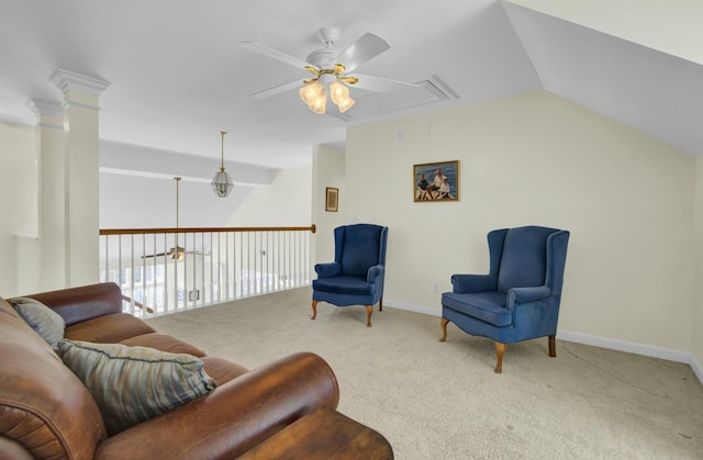 living area featuring lofted ceiling, carpet, attic access, and ceiling fan