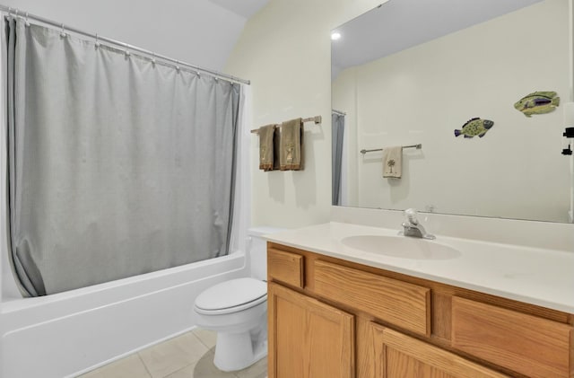 bathroom featuring shower / tub combo with curtain, vanity, toilet, and tile patterned floors