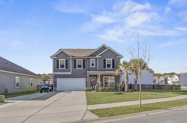 view of front of house featuring a front yard and a garage