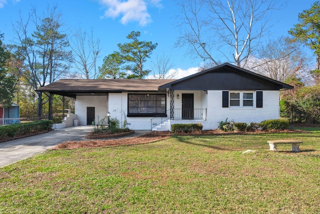 single story home with a front yard and a carport