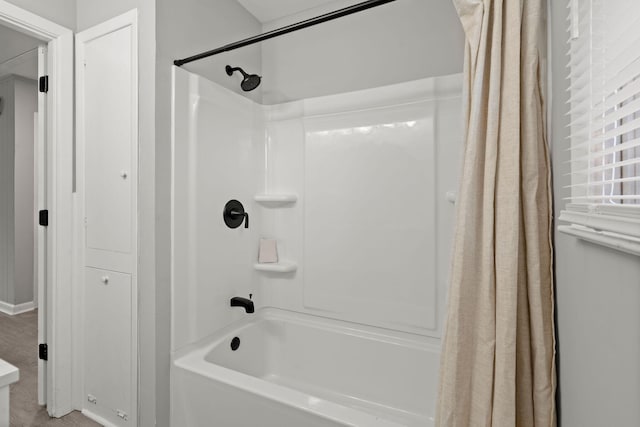 bathroom with shower / bathtub combination with curtain