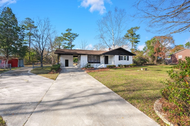 ranch-style house with a front lawn and a carport