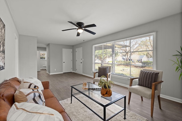 living room featuring ceiling fan and hardwood / wood-style floors