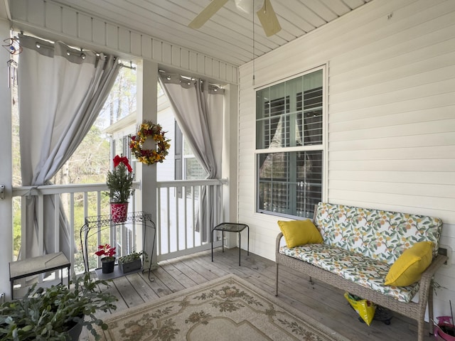 sunroom with a ceiling fan