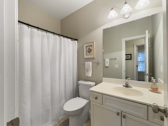 full bathroom featuring vanity and toilet