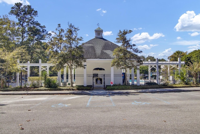 view of property with fence