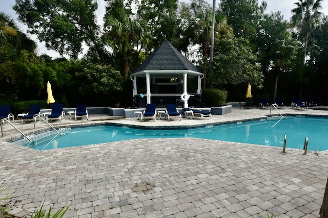 view of pool featuring a patio and a gazebo