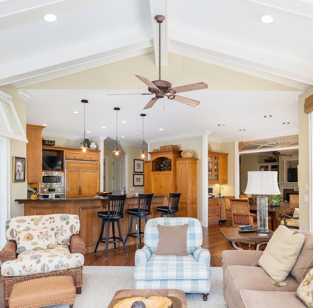 living room with dark wood-type flooring, lofted ceiling with beams, and crown molding