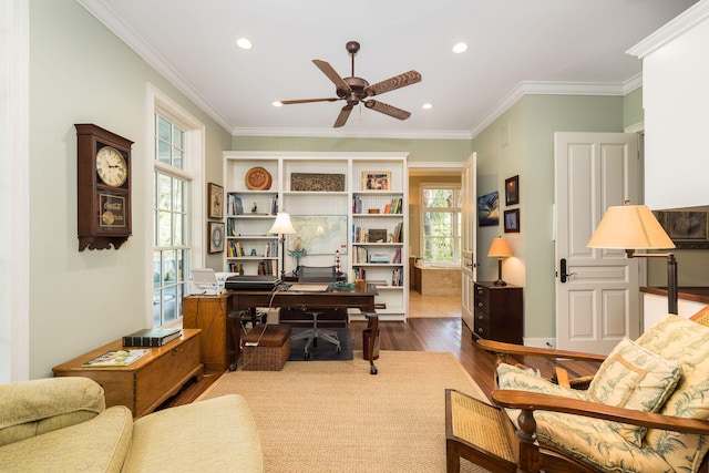 office area featuring crown molding, wood-type flooring, and plenty of natural light