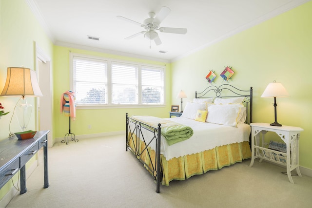 bedroom with crown molding, light carpet, and ceiling fan