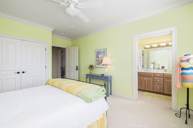 bedroom with connected bathroom, a closet, crown molding, light colored carpet, and ceiling fan