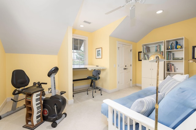 interior space featuring lofted ceiling, light colored carpet, and ceiling fan