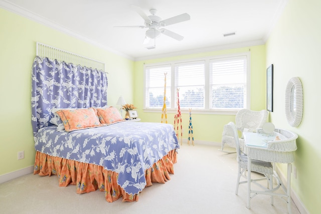 carpeted bedroom featuring ceiling fan and ornamental molding