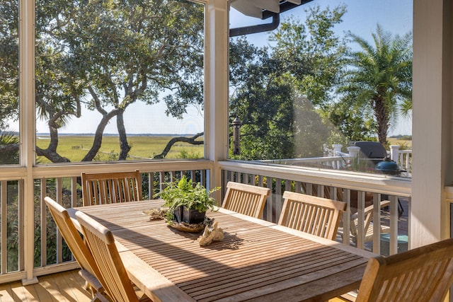 wooden deck with a rural view