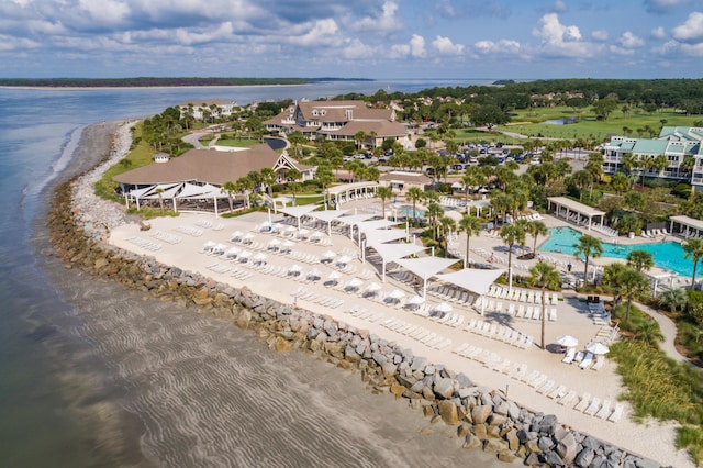 aerial view with a water view and a beach view