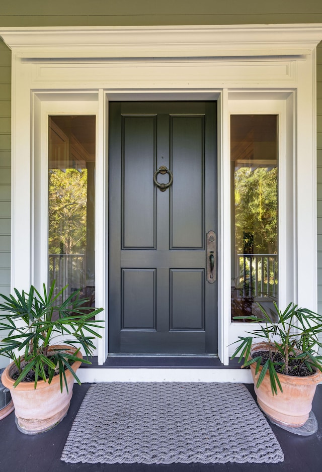 doorway to property with covered porch