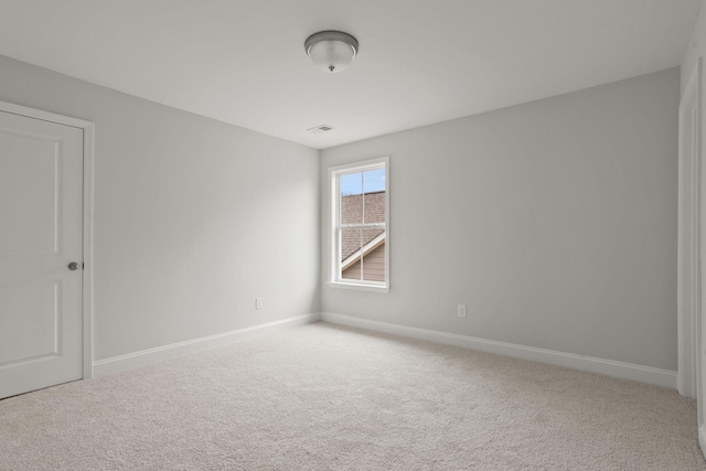 unfurnished room with carpet flooring