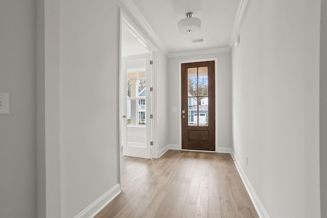 entryway featuring light hardwood / wood-style flooring and ornamental molding