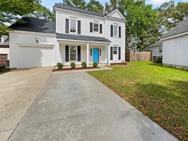 view of front of home with a garage, a front lawn, central AC unit, and covered porch