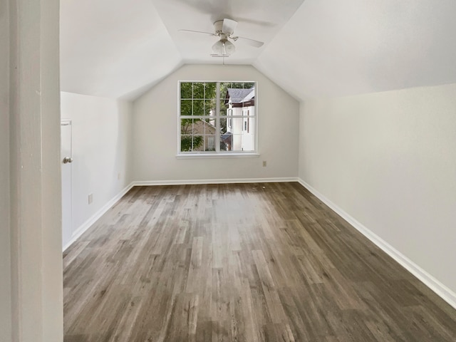 additional living space with lofted ceiling, ceiling fan, and dark hardwood / wood-style flooring