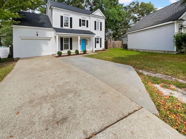 front facade featuring a front yard and a garage