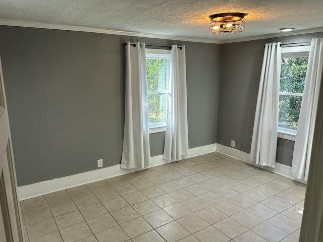 unfurnished room featuring light tile patterned floors, a wealth of natural light, and ornamental molding