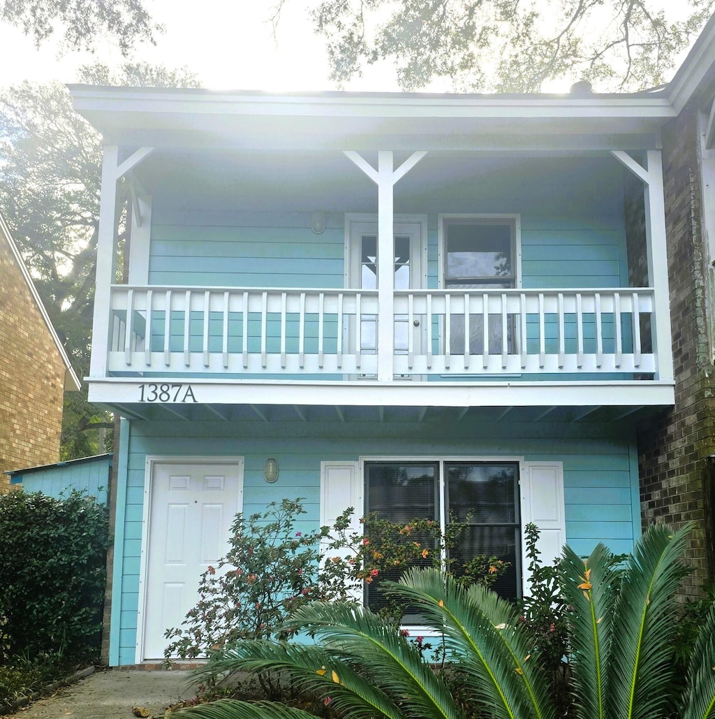 view of front of home with a balcony