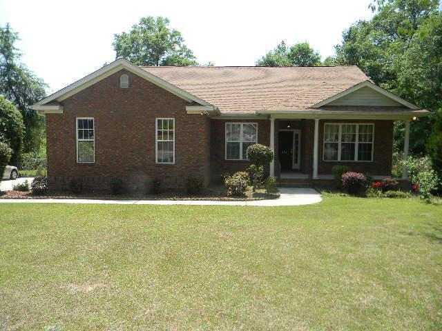 ranch-style house with a front lawn