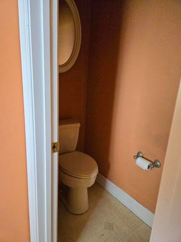 bathroom with tile floors and toilet