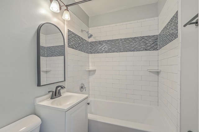 bathroom with toilet, shower / bathtub combination, and vanity