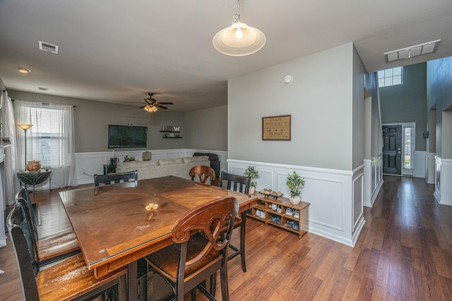 dining room with ceiling fan and wood-type flooring