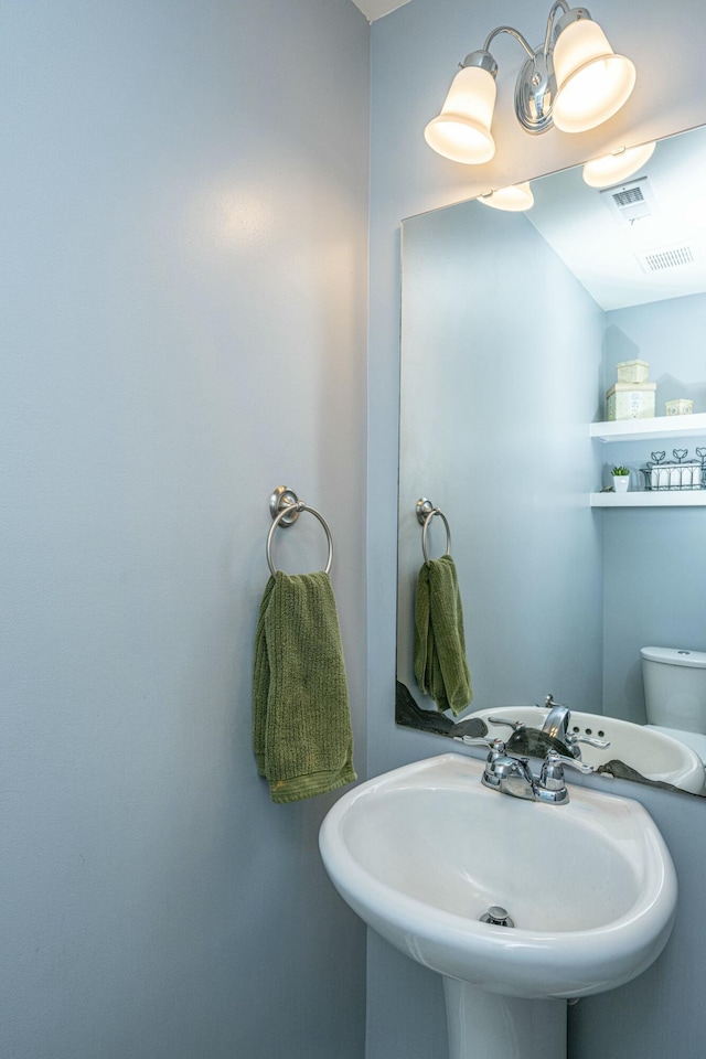 bathroom with toilet and sink