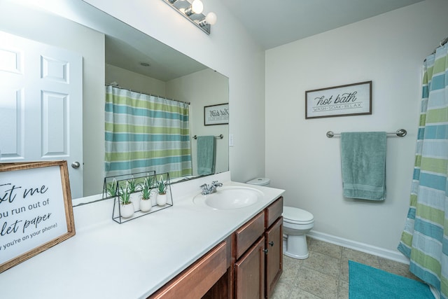 bathroom featuring toilet and vanity