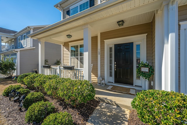 doorway to property featuring a porch