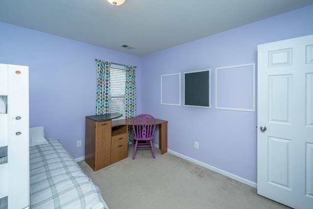 bedroom featuring light colored carpet