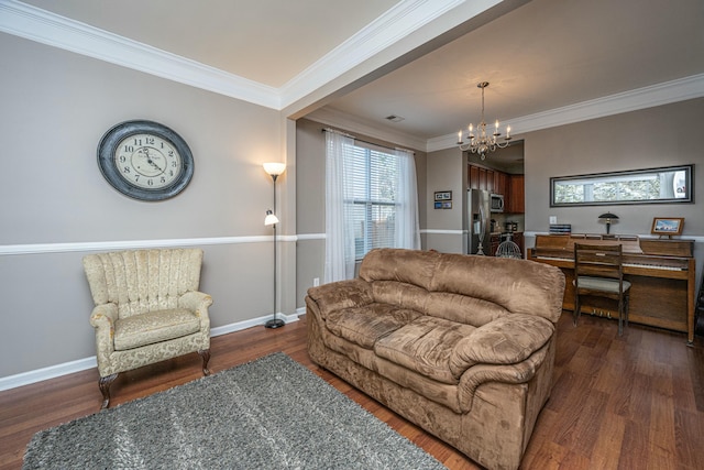 living room featuring dark hardwood / wood-style flooring, crown molding, and a notable chandelier