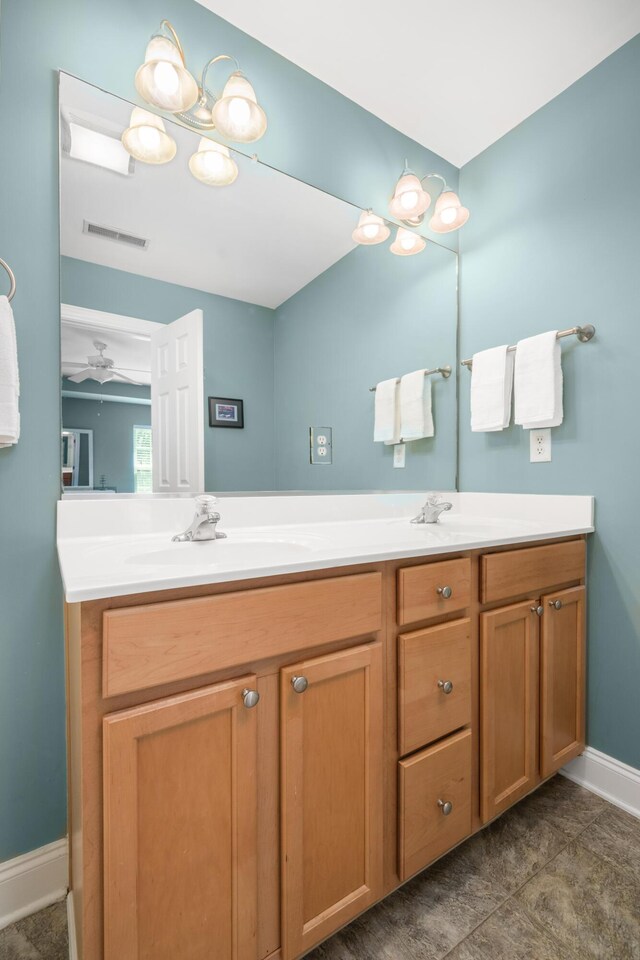 1813 Parkland Preserve Ln, Charleston, SC 29412 - bathroom with double vanity, baseboards, and a ceiling fan