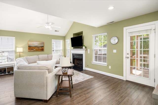 1813 Parkland Preserve Ln, Charleston, SC 29412 - living room with a fireplace with flush hearth, a ceiling fan, dark wood-style flooring, vaulted ceiling, and recessed lighting