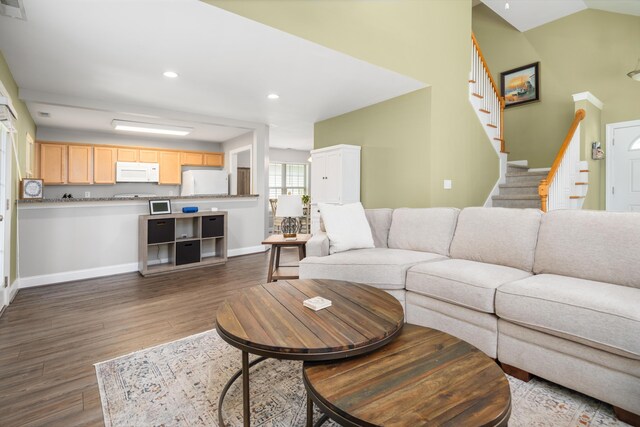 1813 Parkland Preserve Ln, Charleston, SC 29412 - living room with wood finished floors, stairway, baseboards, recessed lighting, and lofted ceiling