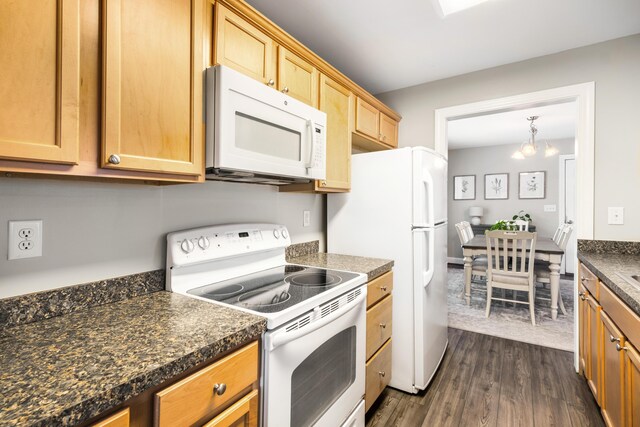 1813 Parkland Preserve Ln, Charleston, SC 29412 - kitchen with white appliances, dark countertops, dark wood-style flooring, a chandelier, and light brown cabinetry
