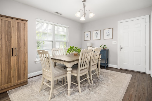 1813 Parkland Preserve Ln, Charleston, SC 29412 - dining space with dark wood finished floors, baseboards, and a chandelier