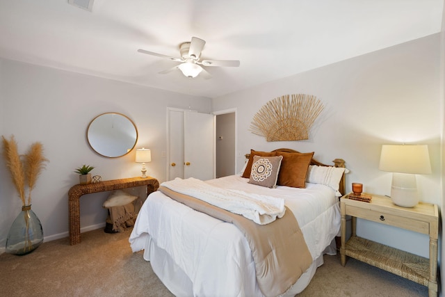 bedroom featuring ceiling fan and light carpet