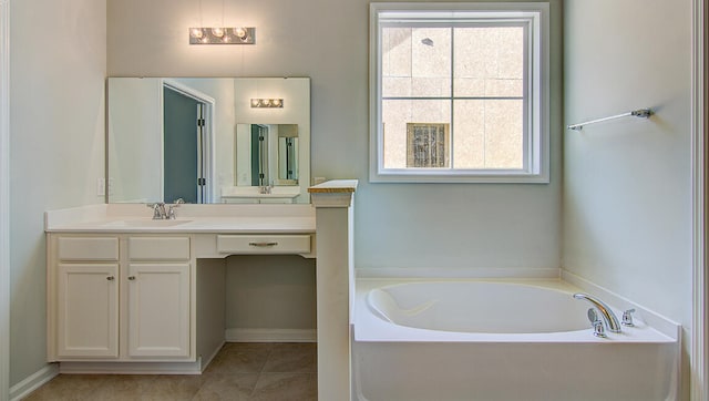 bathroom featuring tile patterned flooring, a tub to relax in, and vanity