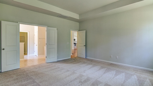 unfurnished bedroom featuring light colored carpet