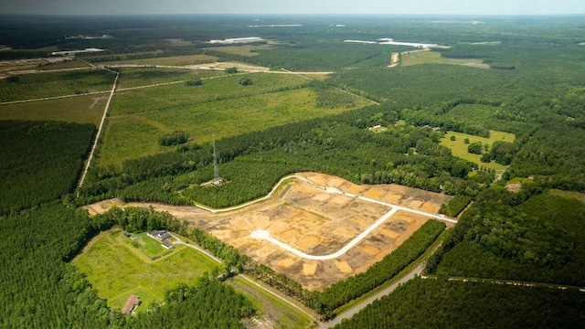 birds eye view of property with a rural view