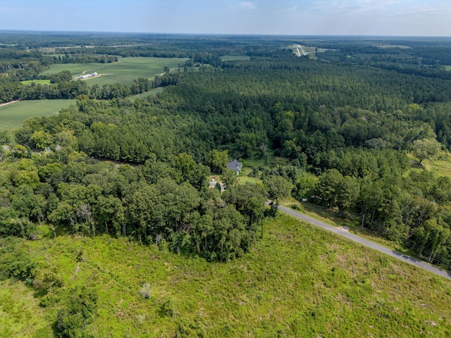 aerial view featuring a wooded view