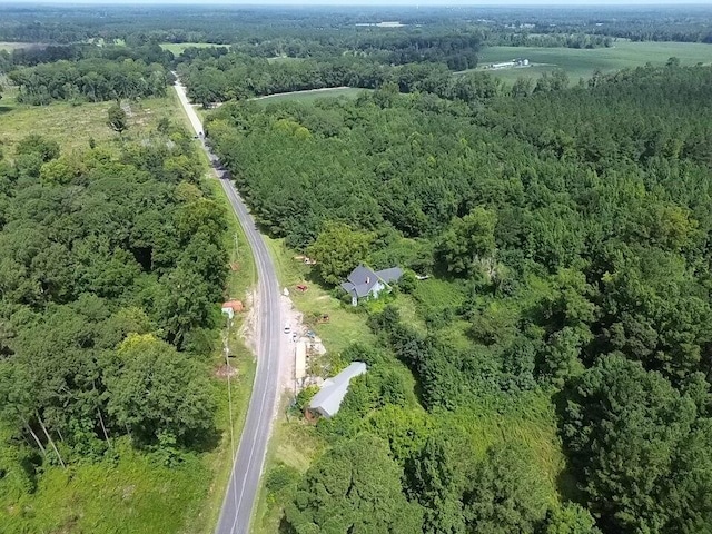 drone / aerial view featuring a view of trees