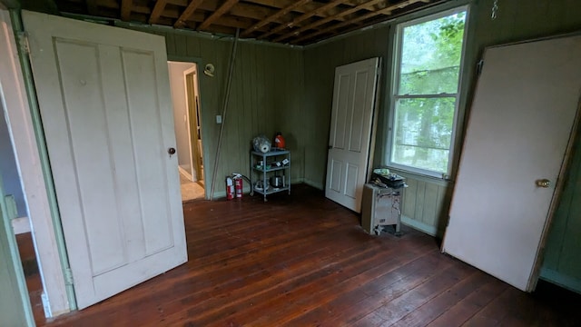 empty room with dark wood-type flooring