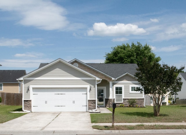 115 Hyrne Dr, Goose Creek, SC 29445 - view of front of house with stone siding, an attached garage, and driveway