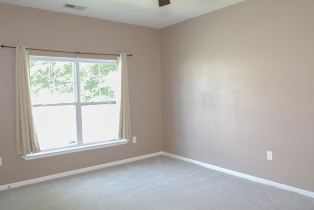 115 Hyrne Dr, Goose Creek, SC 29445 - spare room featuring light carpet, ceiling fan, and baseboards